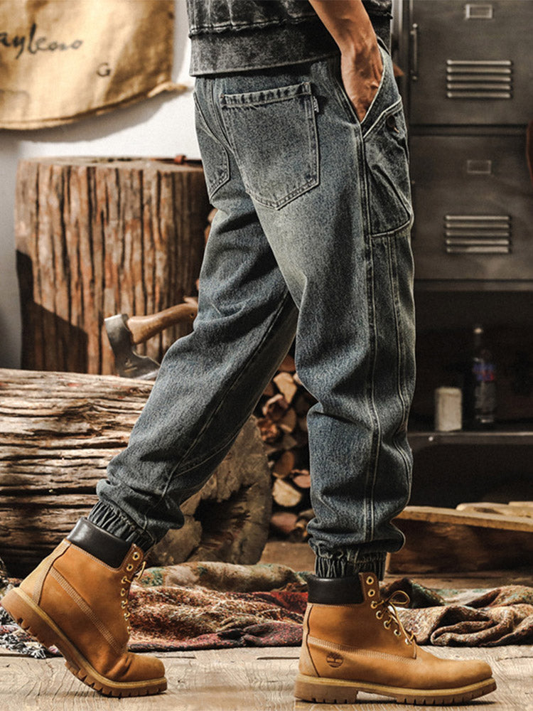 Herrenjeans mit weitem Bein, Vintage-Waschung und elastischen Beinabschlüssen