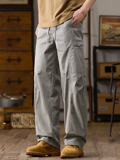 Pantalon cargo homme à jambes larges et poches multiples zippées