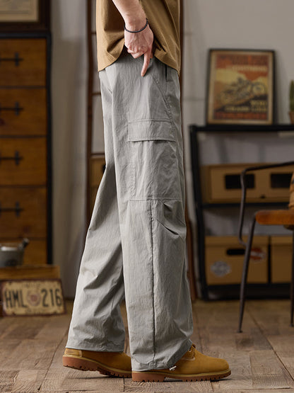 Pantalon cargo homme à jambes larges et poches multiples zippées