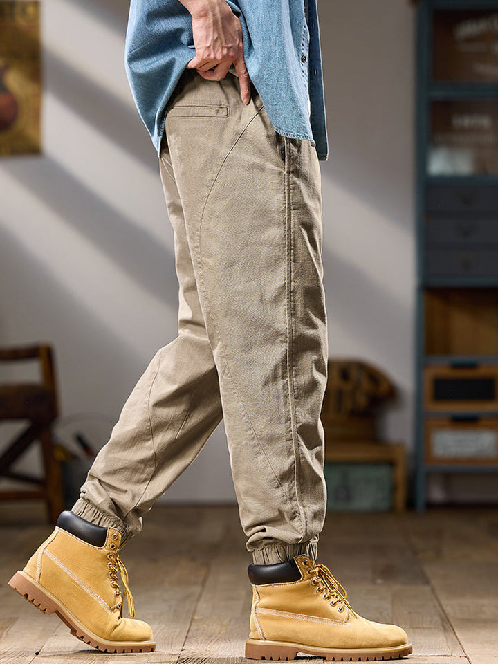 Pantalones casuales de algodón puro para hombre, corte relajado, múltiples bolsillos y puños elásticos