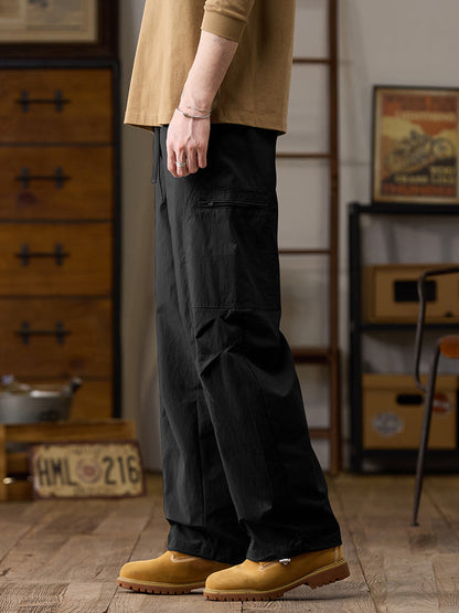 Pantalon cargo homme à jambes larges et poches multiples zippées