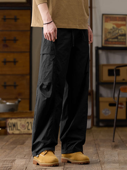 Pantalon cargo homme à jambes larges et poches multiples zippées
