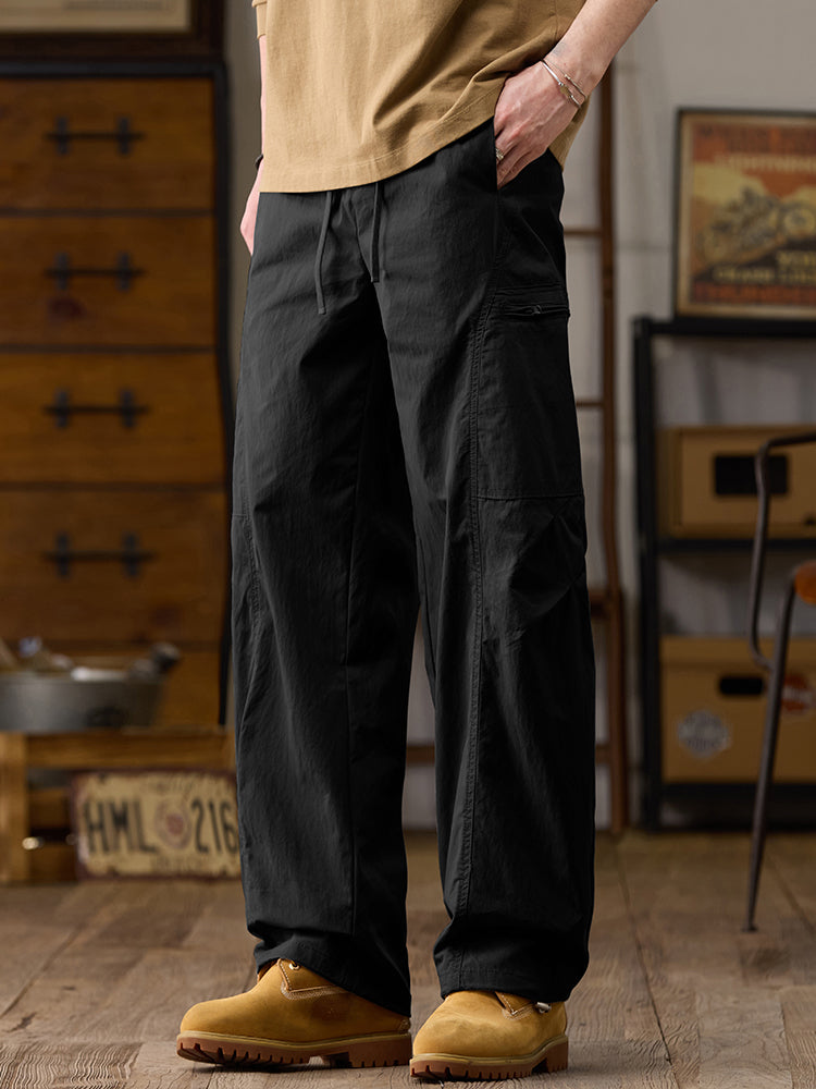 Pantalon cargo homme à jambes larges et poches multiples zippées