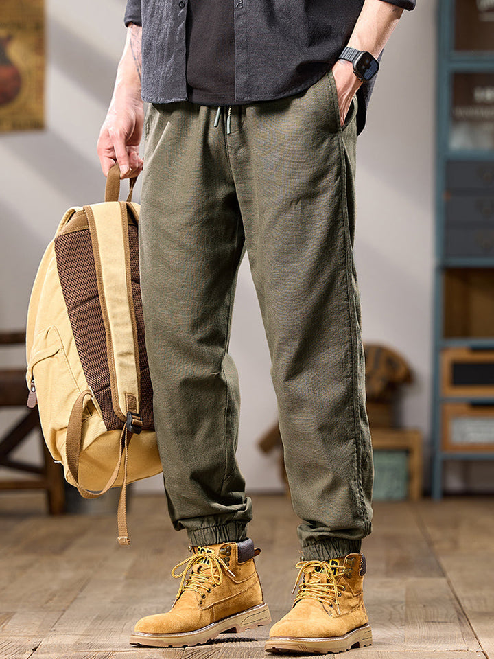 Pantalones casuales de algodón puro para hombre, corte relajado, múltiples bolsillos y puños elásticos